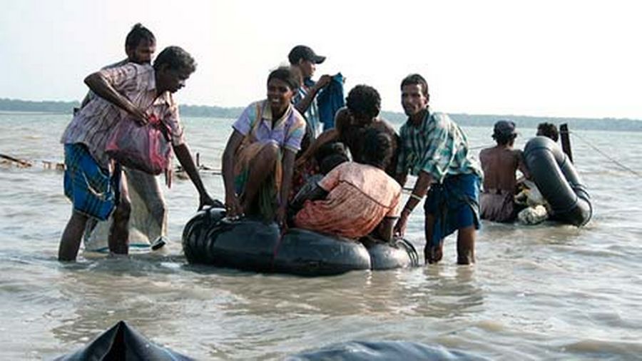 Tamil civilians cross over into Sri Lankan military territory, many by wading across Nandikadal laggon amidst heavy artillery fire. May 14th 2009.